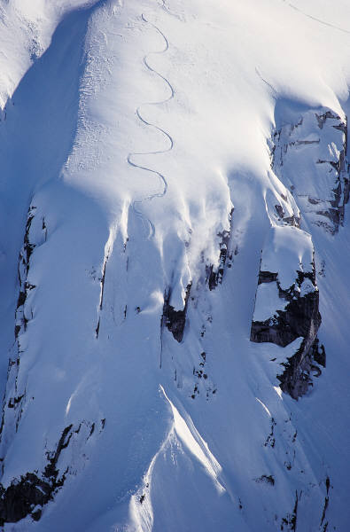 snowboarder going down a mountain